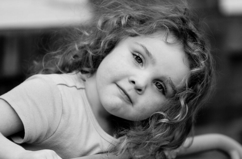 child with curly hair portrait