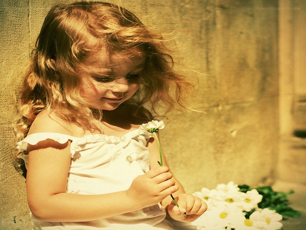 child with daisy flower