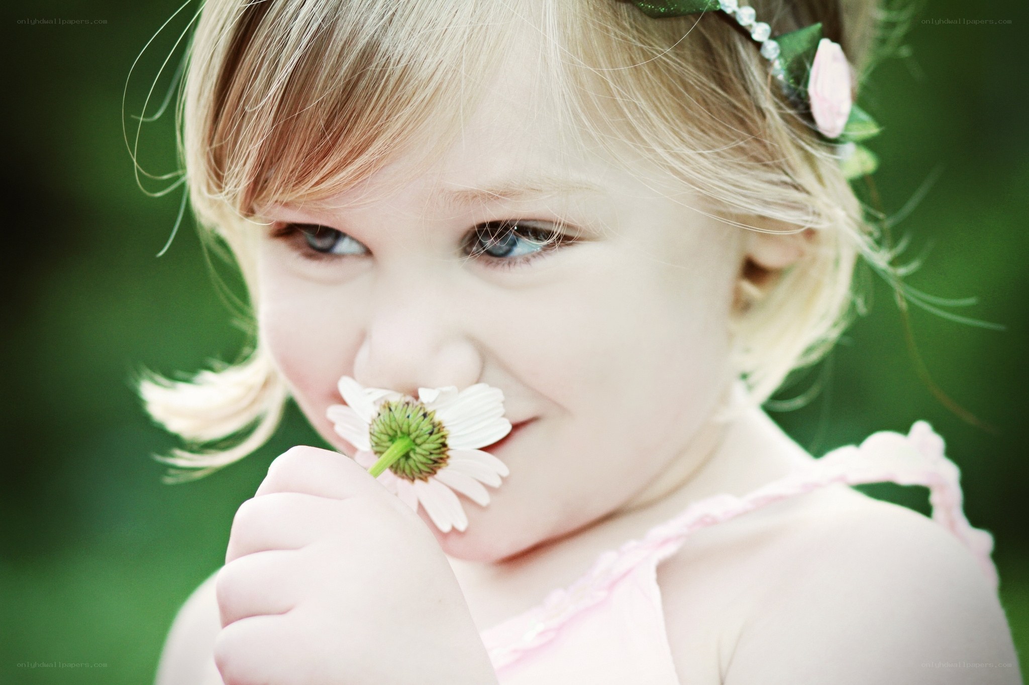 child with daisy flower