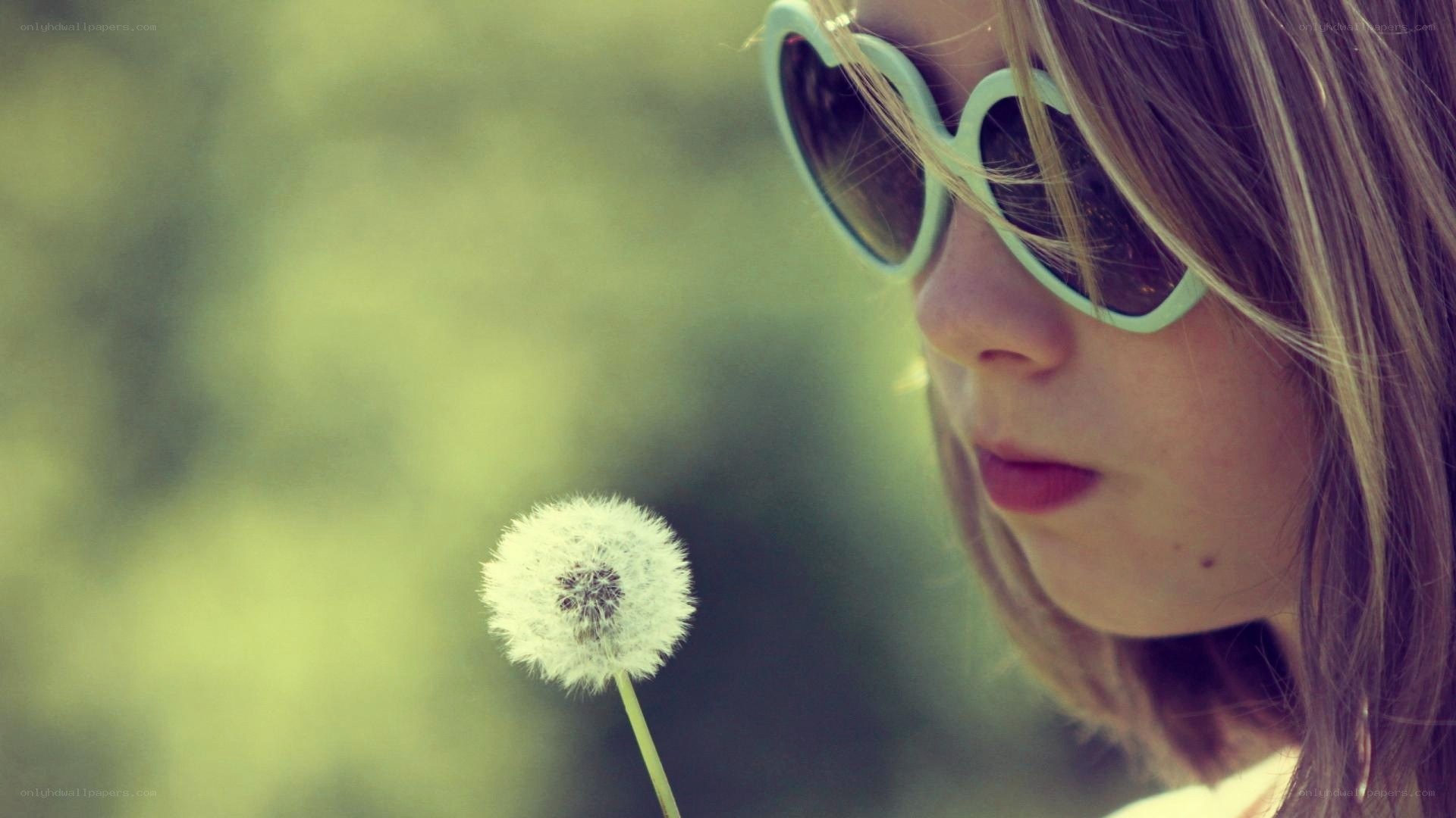 child with dandelion and sunglasses