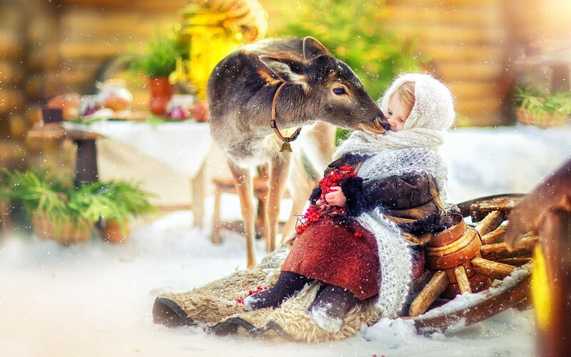 Child with Deer in Snow