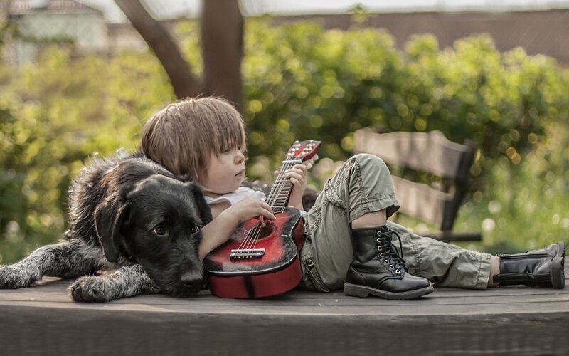 Child with Dog and Guitar