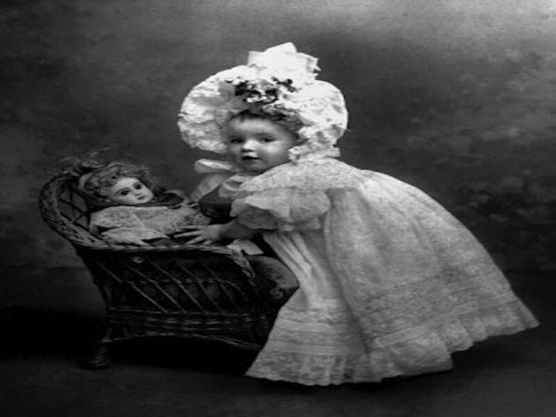 Child with Doll in Basket