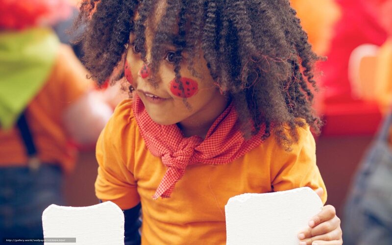 Child with Face Paint — Orange, Playful