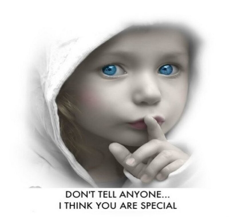 child with finger to lips