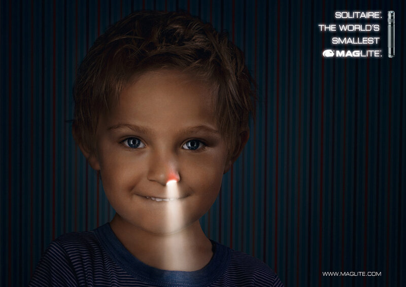 child with flashlight beam