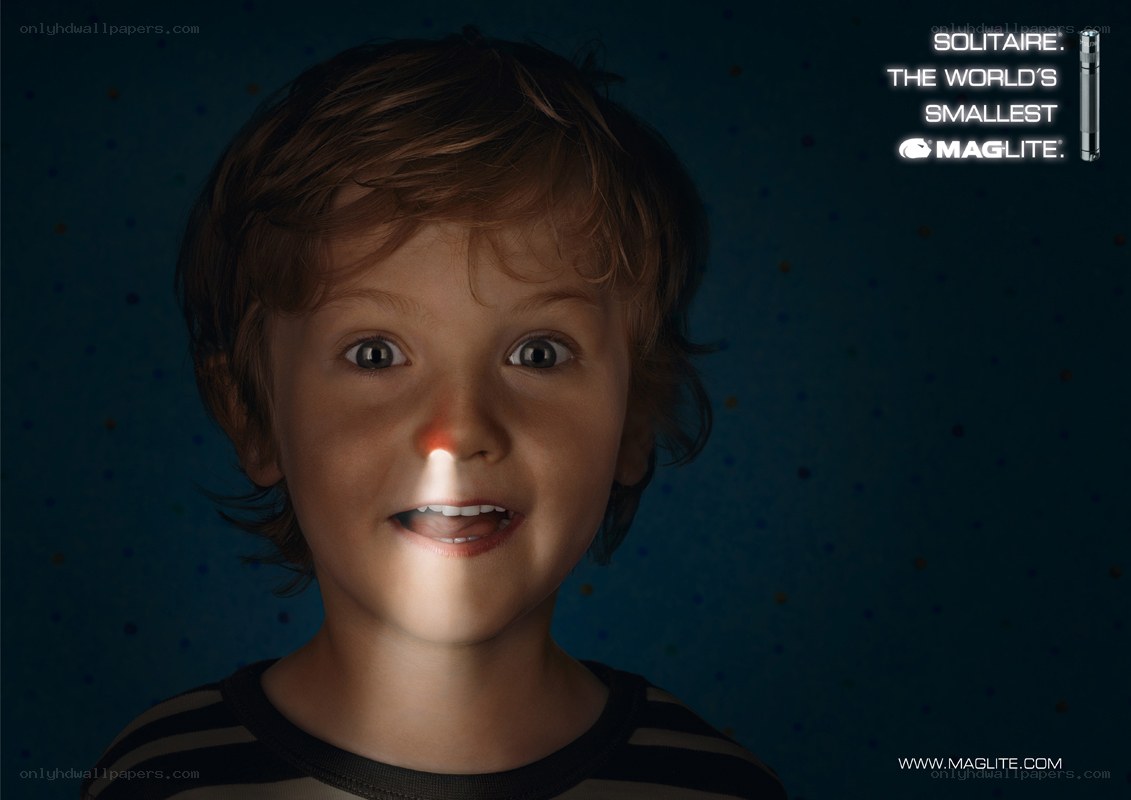 child with flashlight nose