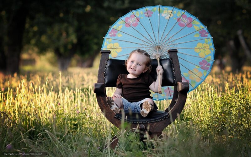 child with floral umbrella