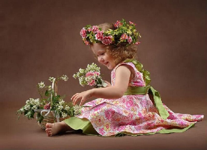 child with flower crown and basket