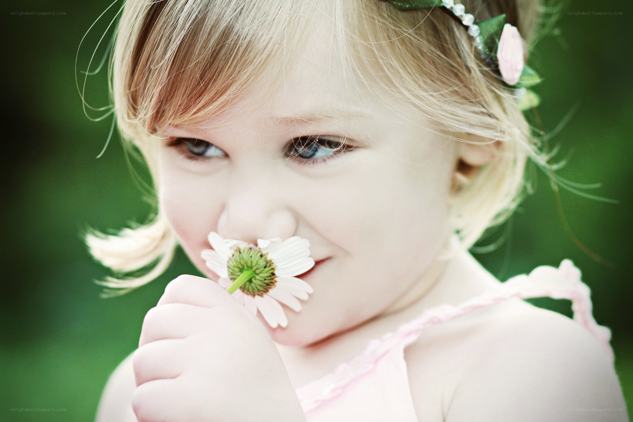 child with flower in garden