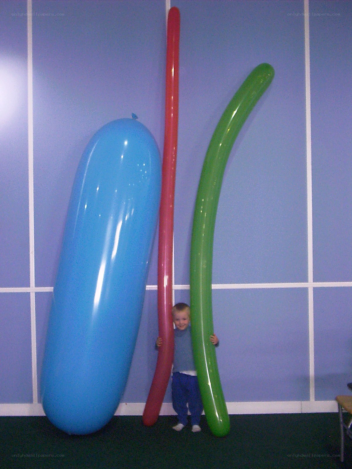 Child with giant balloons