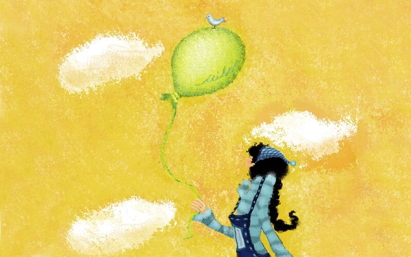 child with green balloon