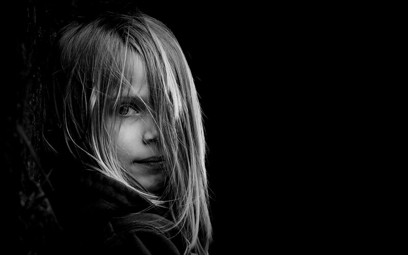 child with hair in face