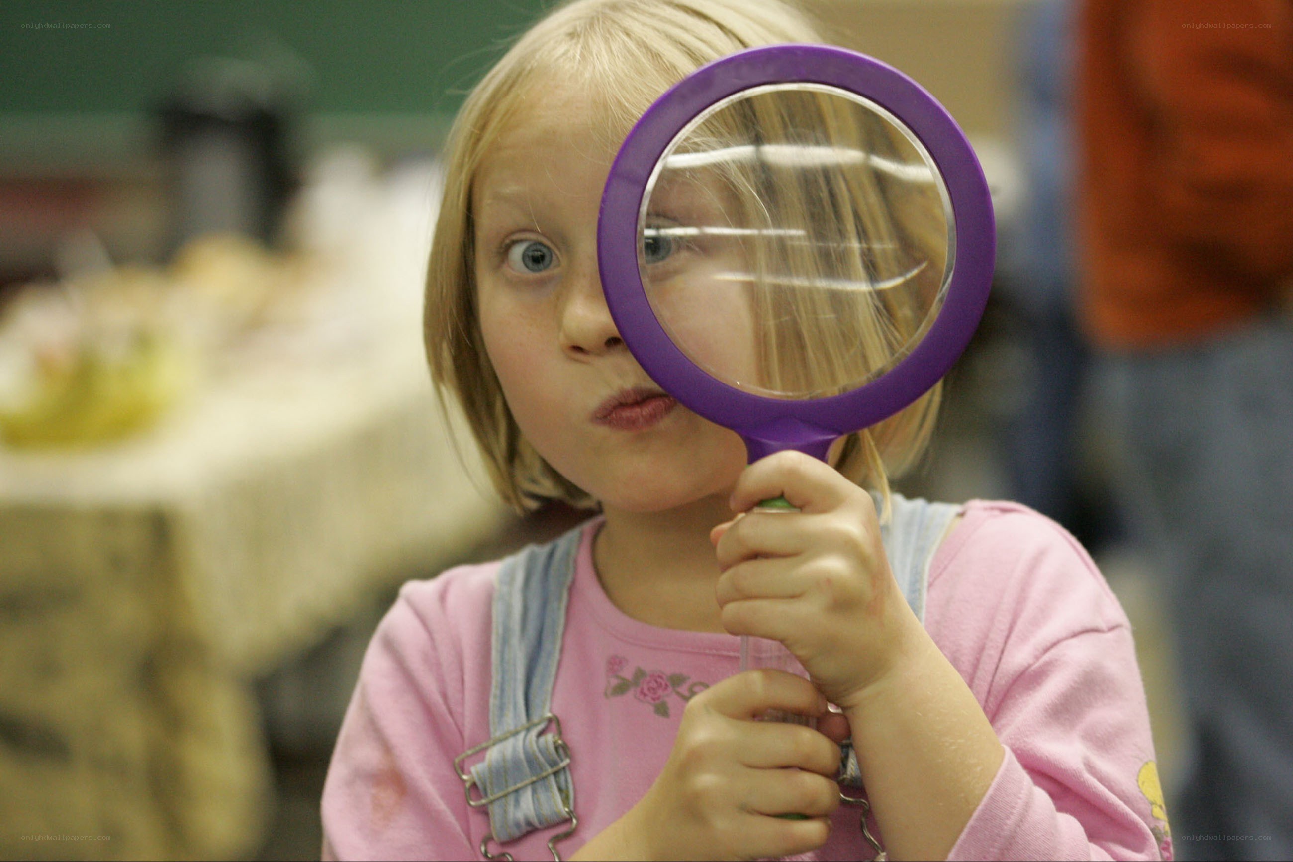 child with magnifying glass