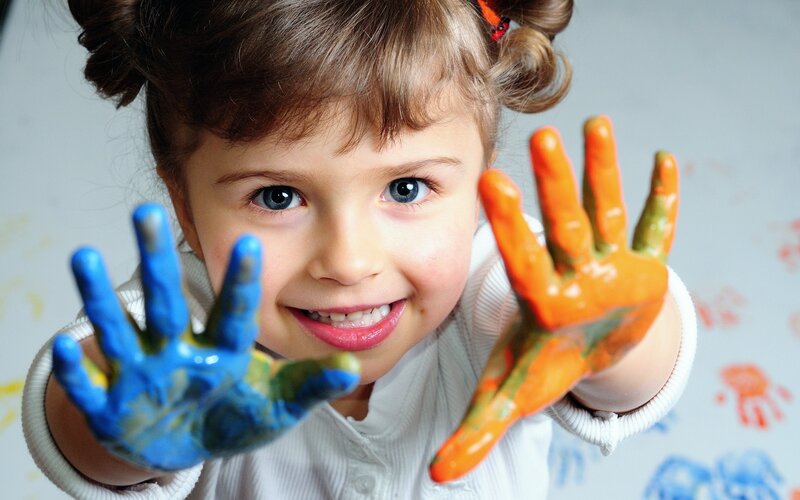 child with painted hands