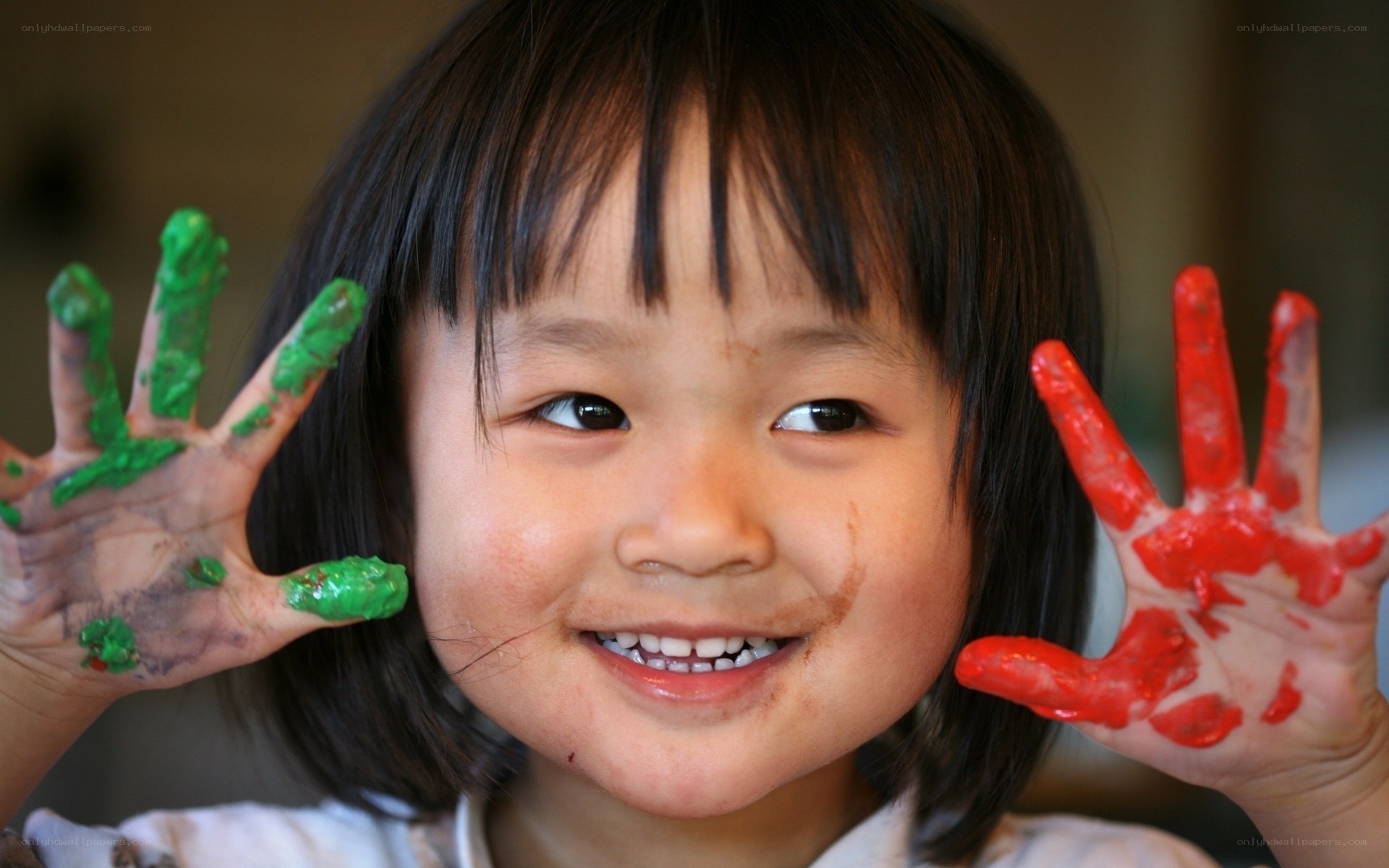 child with painted hands