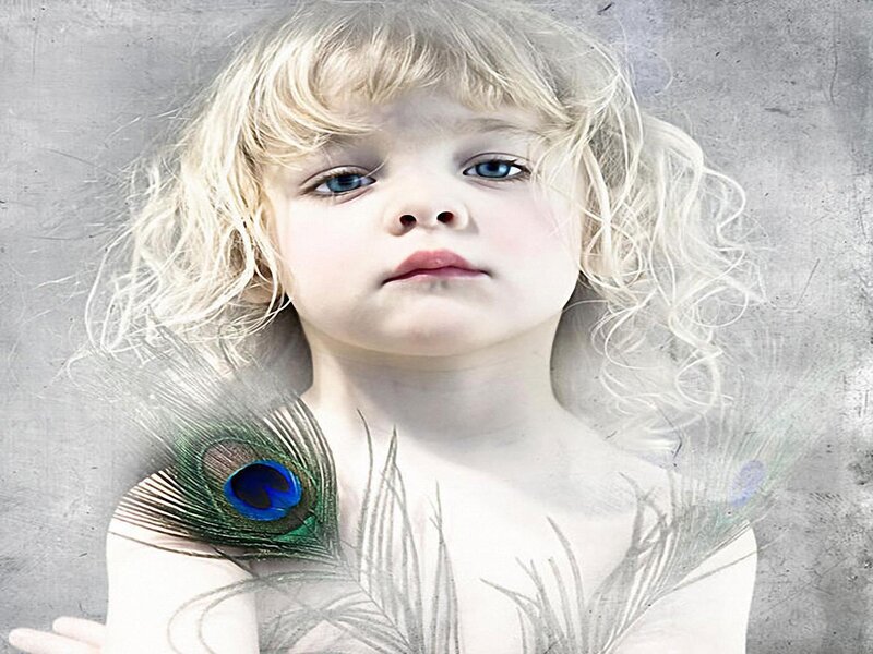 child with peacock feather