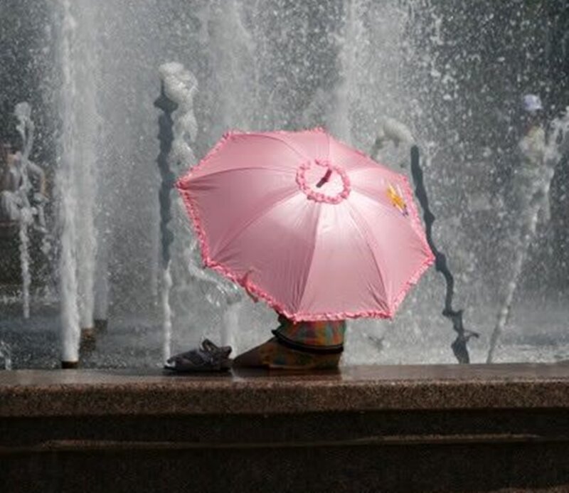 Child with Pink Umbrella — Playful