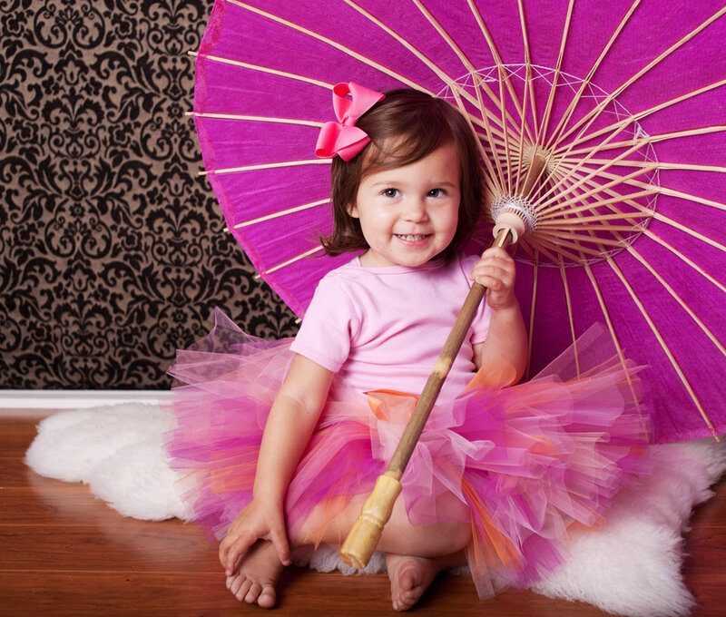 Child with Pink Umbrella