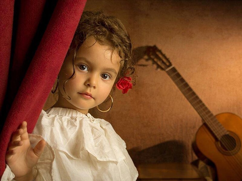 Child with Red Flower — Dramatic