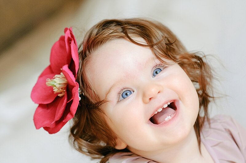 Child with Red Flower