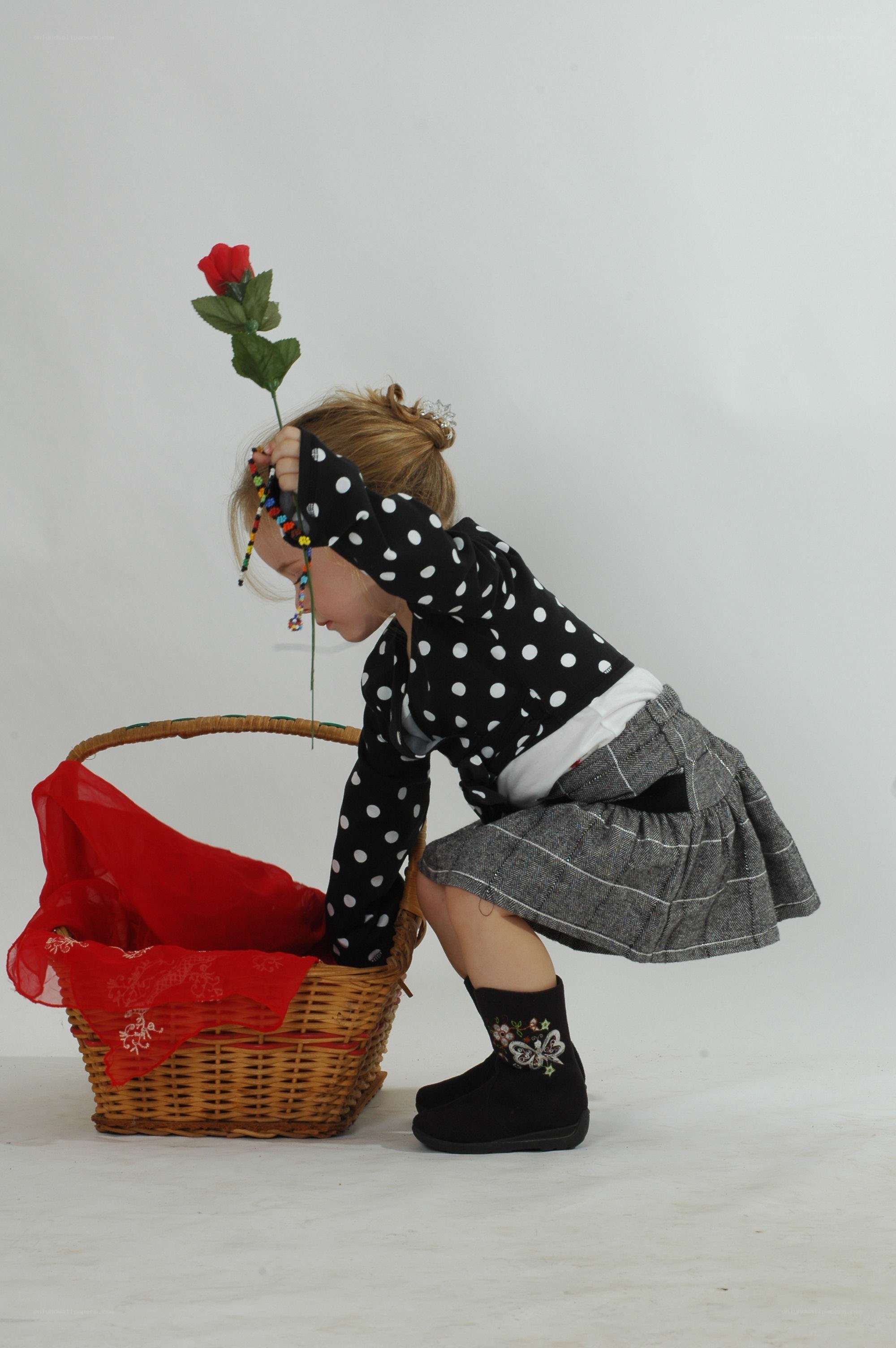 child with rose and basket