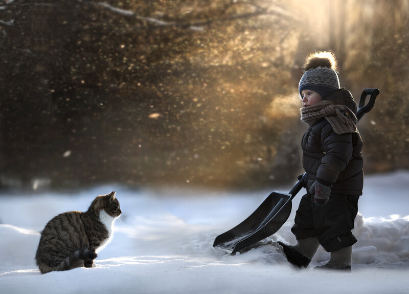 Child with Shovel in Snow