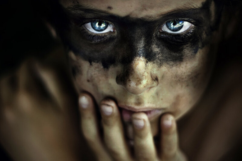child with soot-stained face