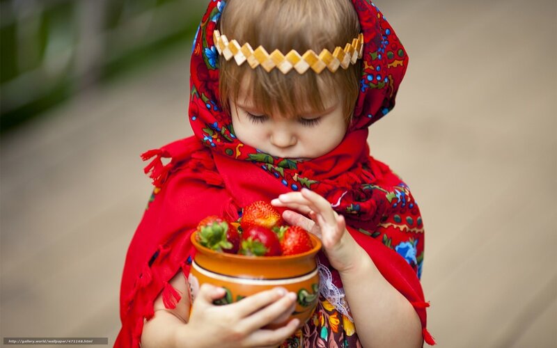 child with strawberries in bowl