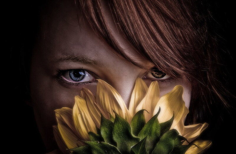 child with sunflower
