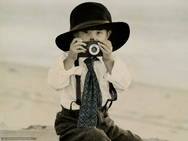 child with vintage camera