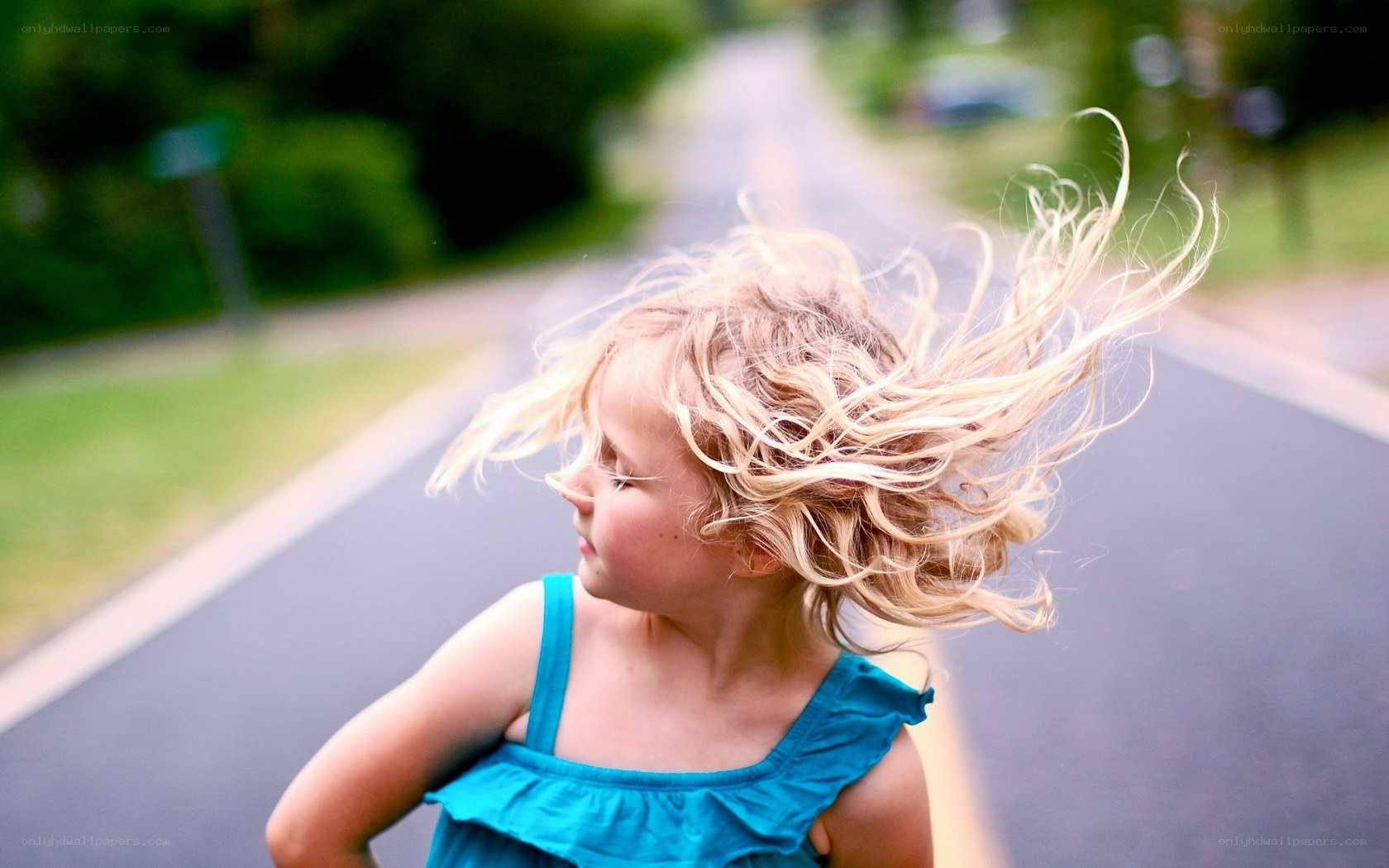 child with wind-blown hair