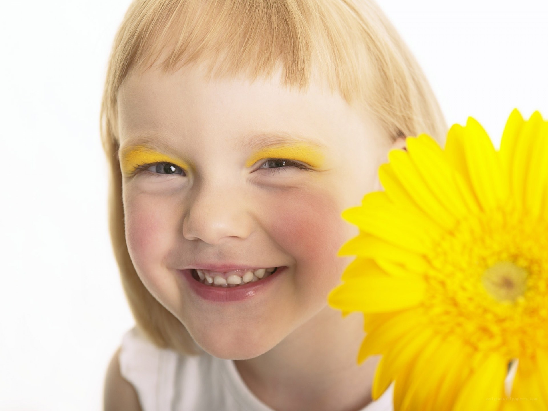 child with yellow flower