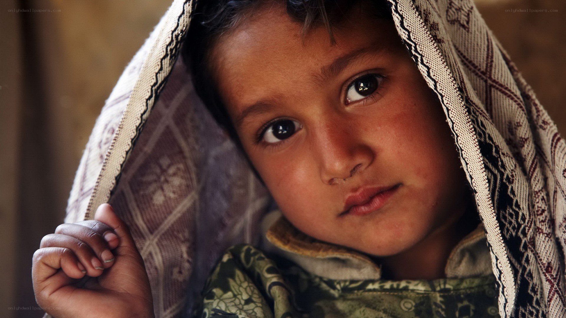 child wrapped in a blanket