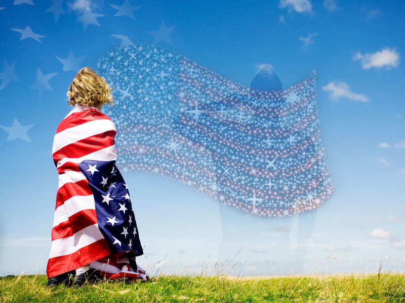 Child wrapped in American flag