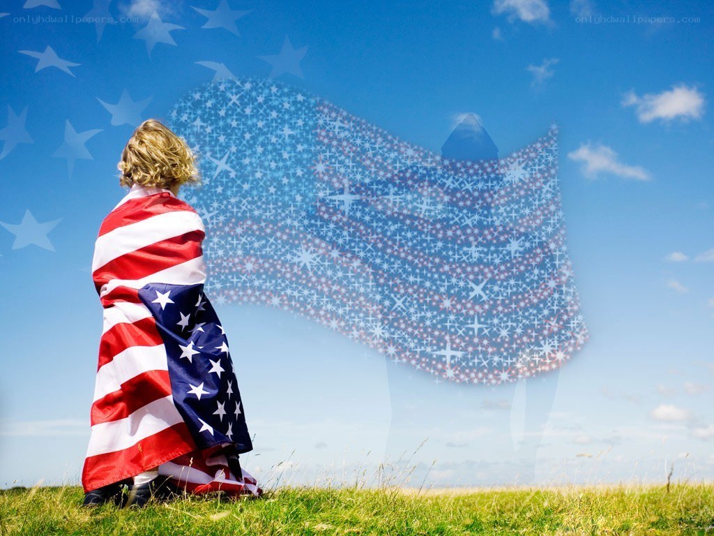 child wrapped in american flag