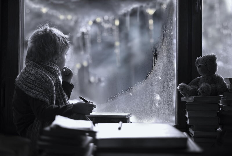 Child Writing at Window