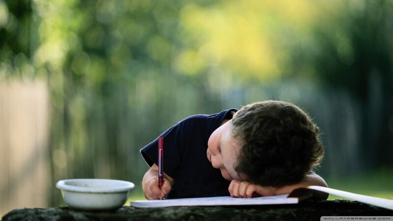 Child Writing in Notebook