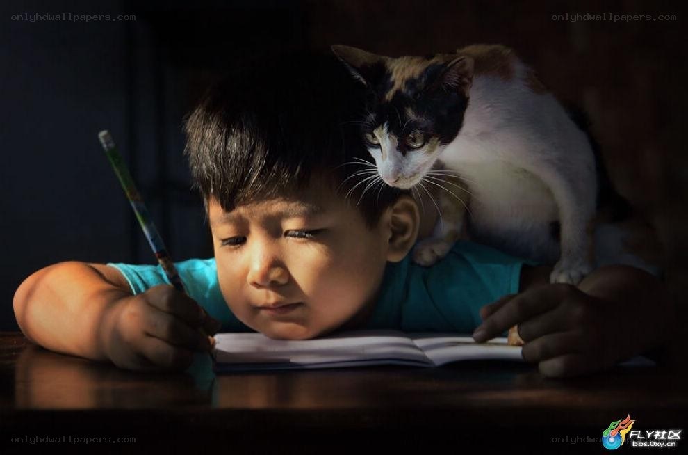 child writing with cat on back