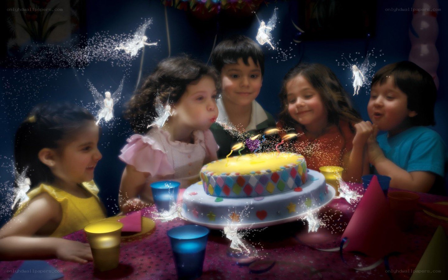Children at birthday party with cake