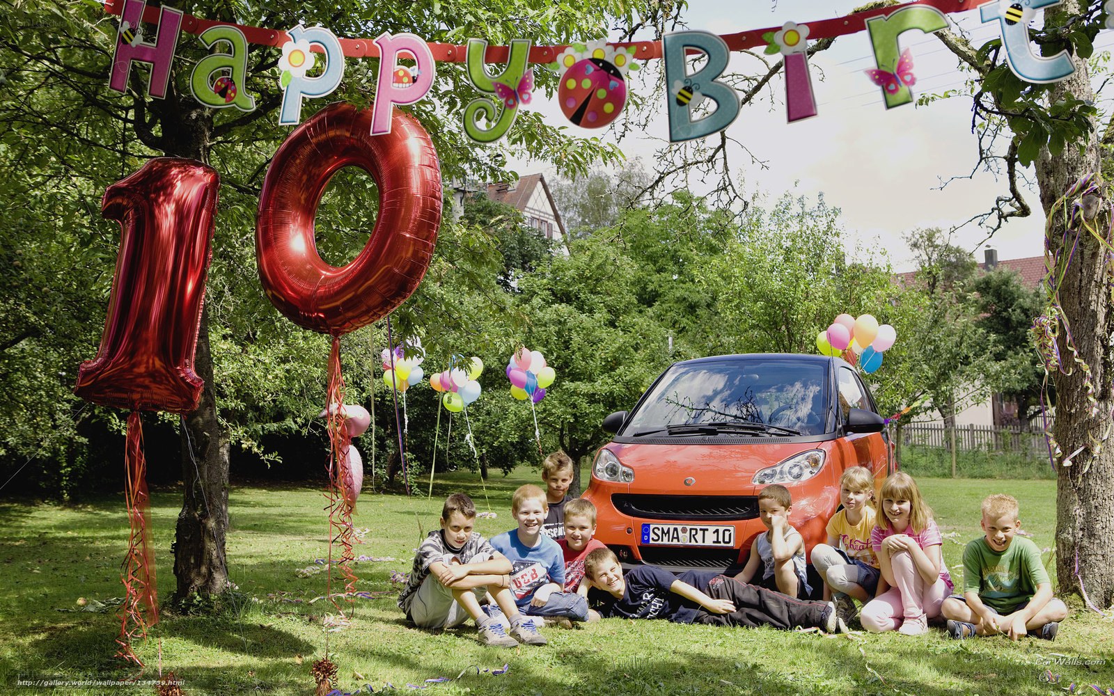 Children at birthday party with car