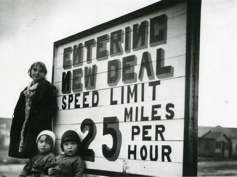 Children at New Deal sign