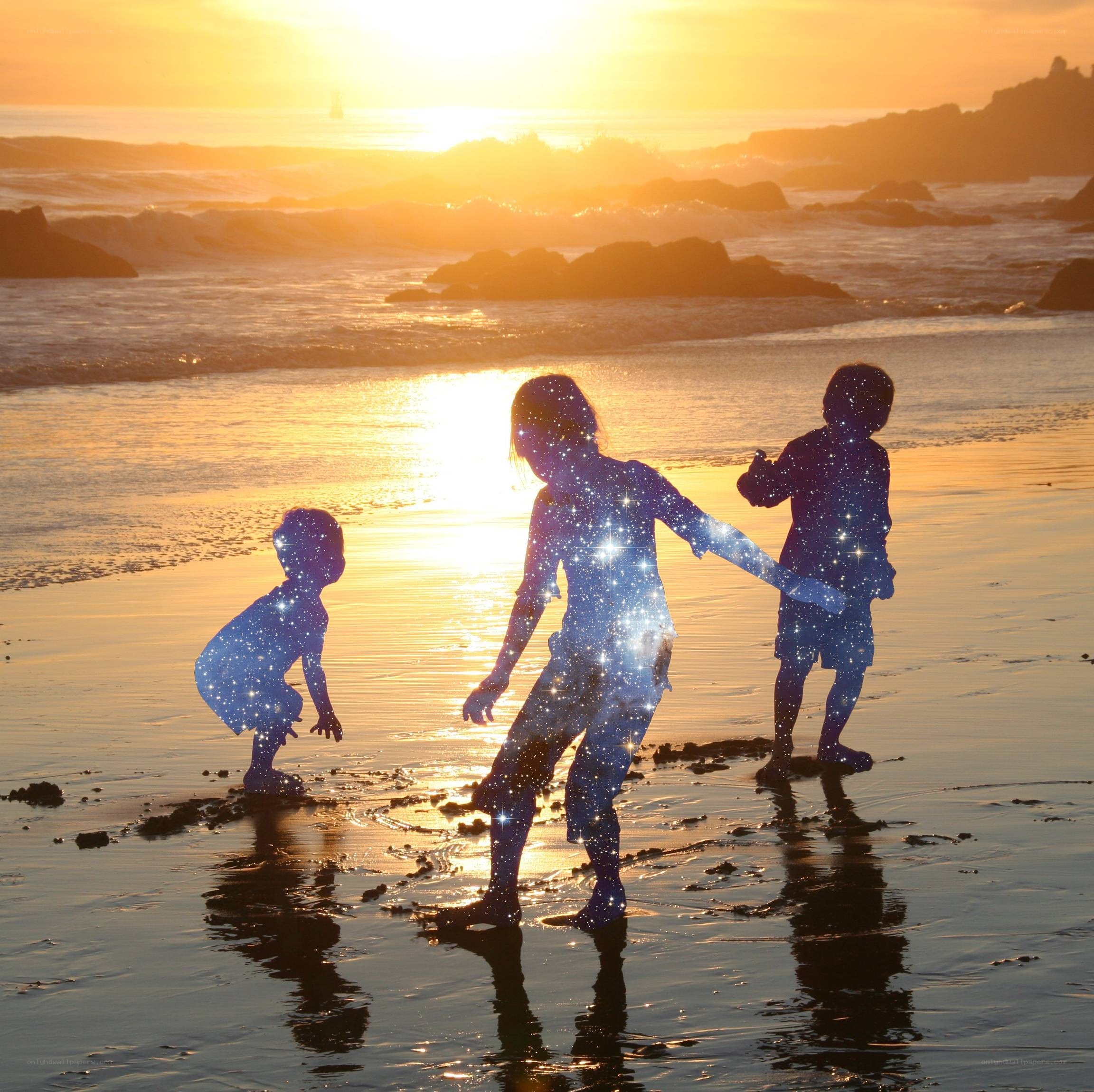 children at sunset on the beach