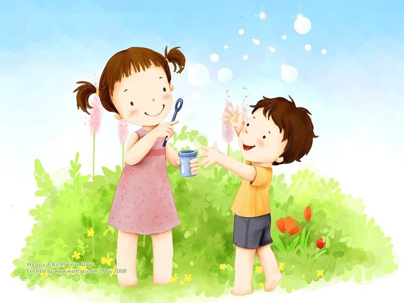 Children blowing bubbles in a garden