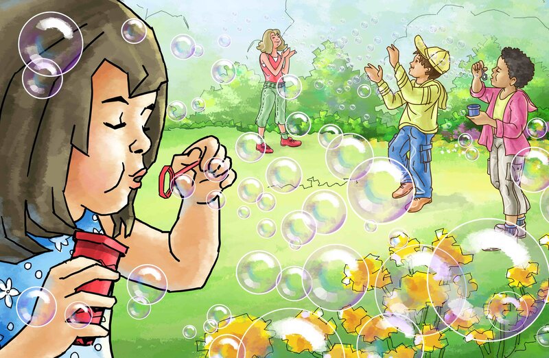 Children blowing bubbles in a park