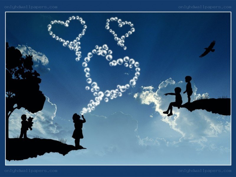 Children blowing bubbles in the sky