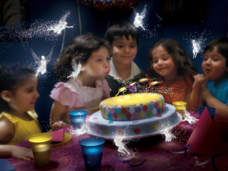 Children celebrating birthday with cake