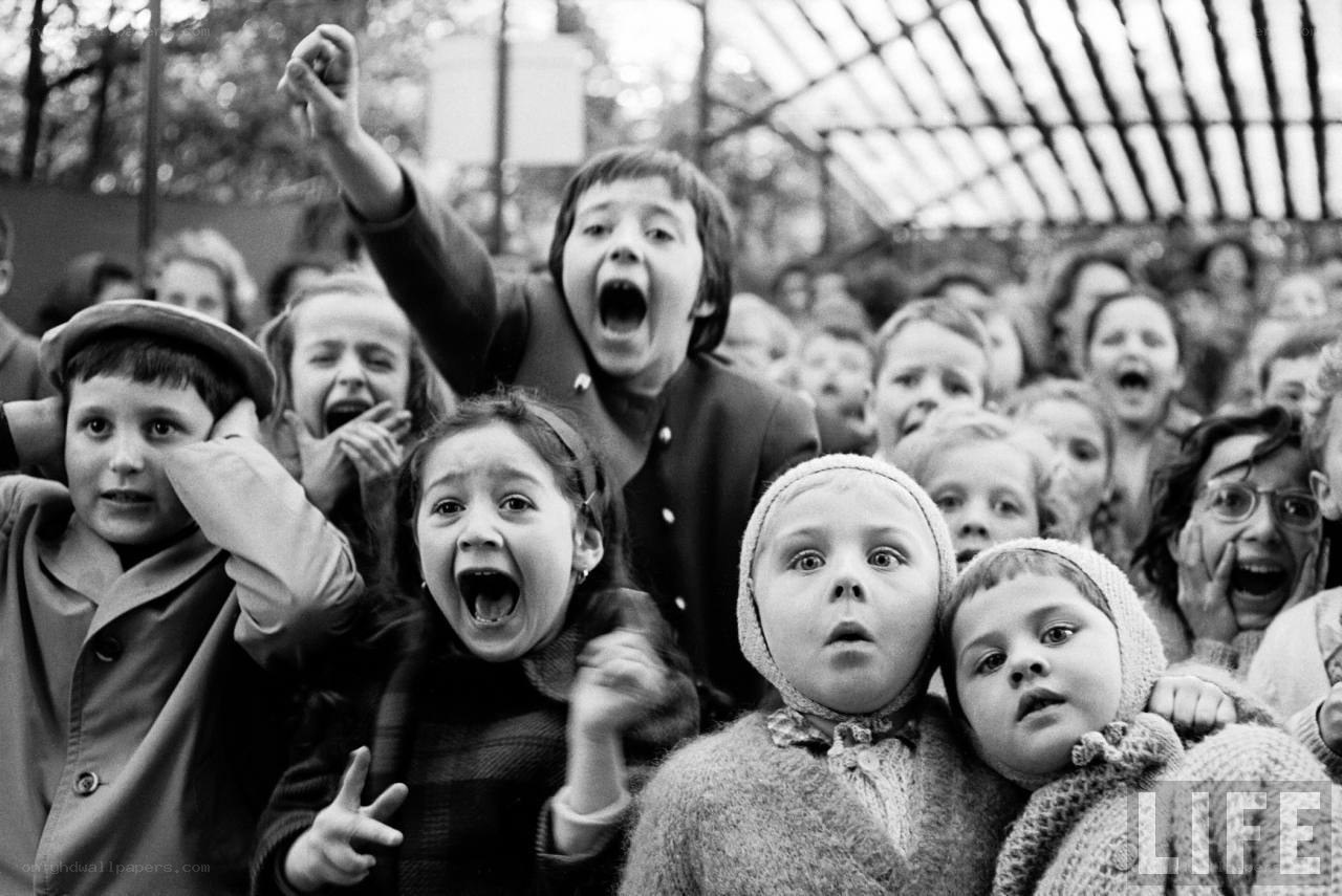 children cheering at an event