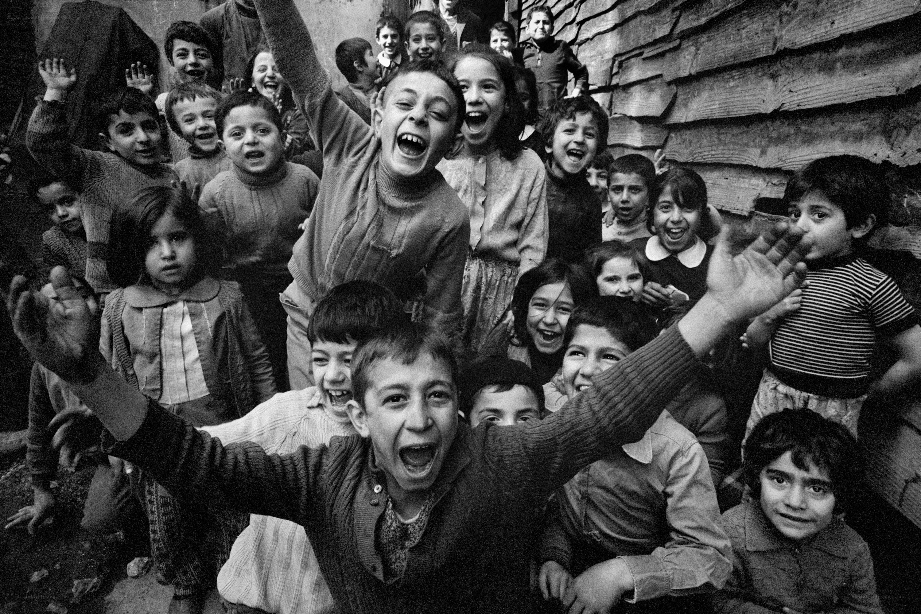 children cheering in a crowd