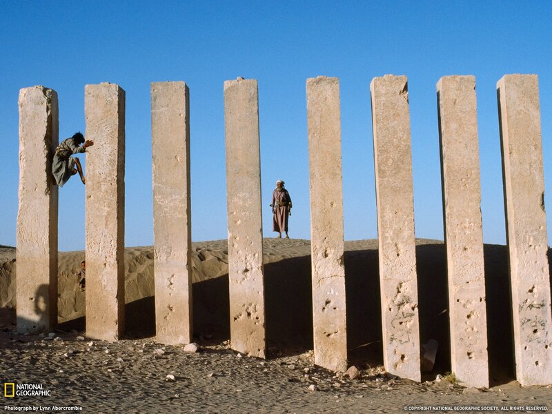 Children climbing ancient pillars